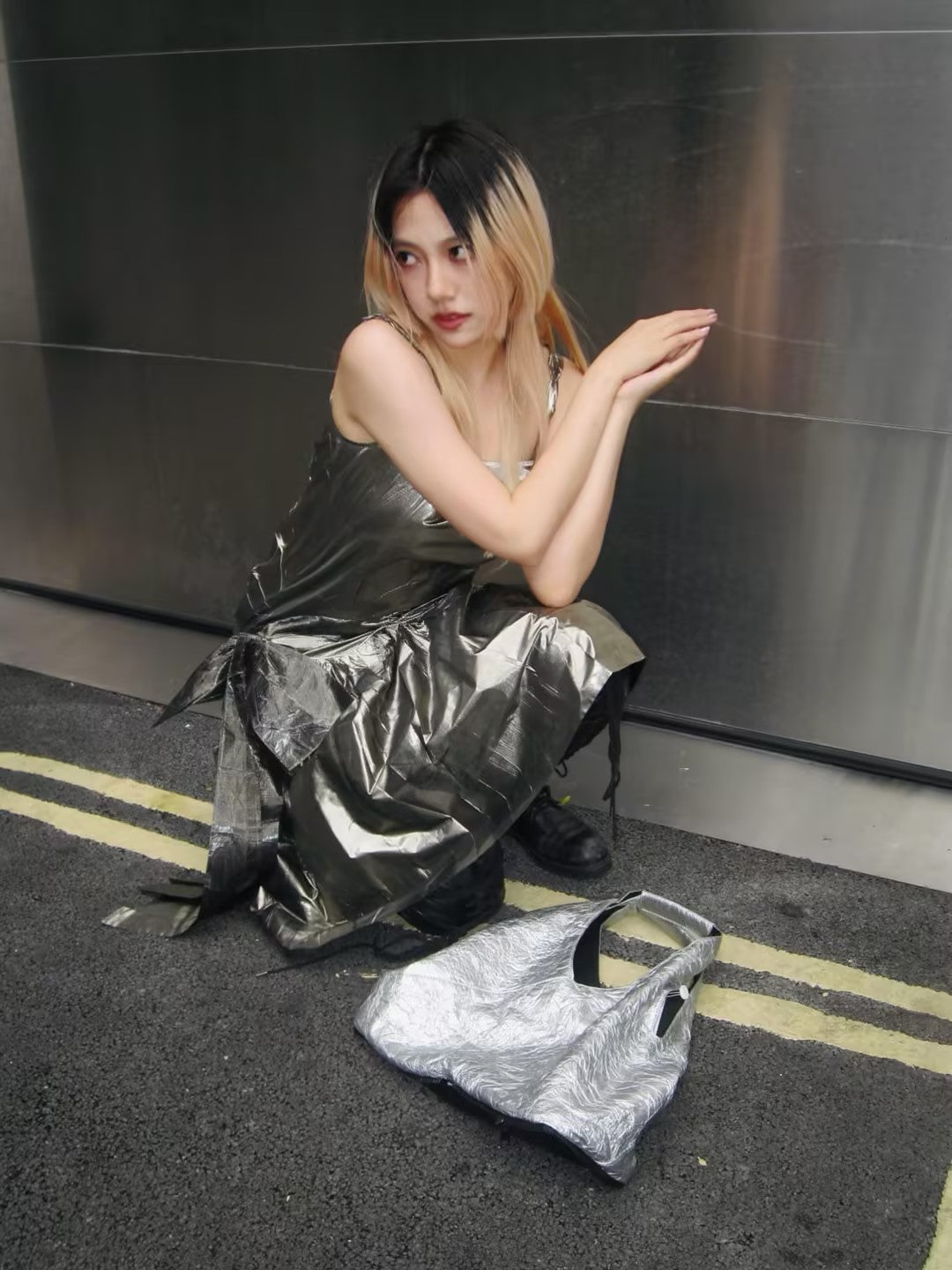 Wrapped in Margiela silver, busy roaming Soho streets - MACHINE-A