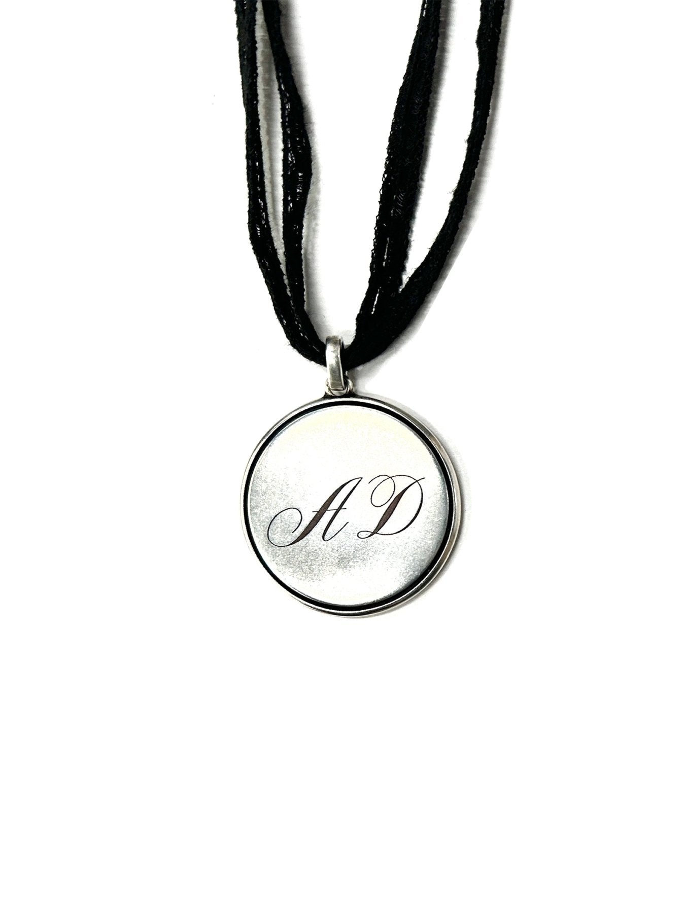 Ann Demeulemeester Silver Monogram Pendant With Lace Ribbon